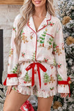 Woman wearing white Christmas pajamas with red trim and holiday print.