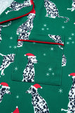 Green fabric with Dalmatian dogs in Santa hats and white stars.