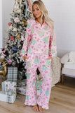 Woman in pink long-sleeve pajamas with Christmas tree and snowman print.
