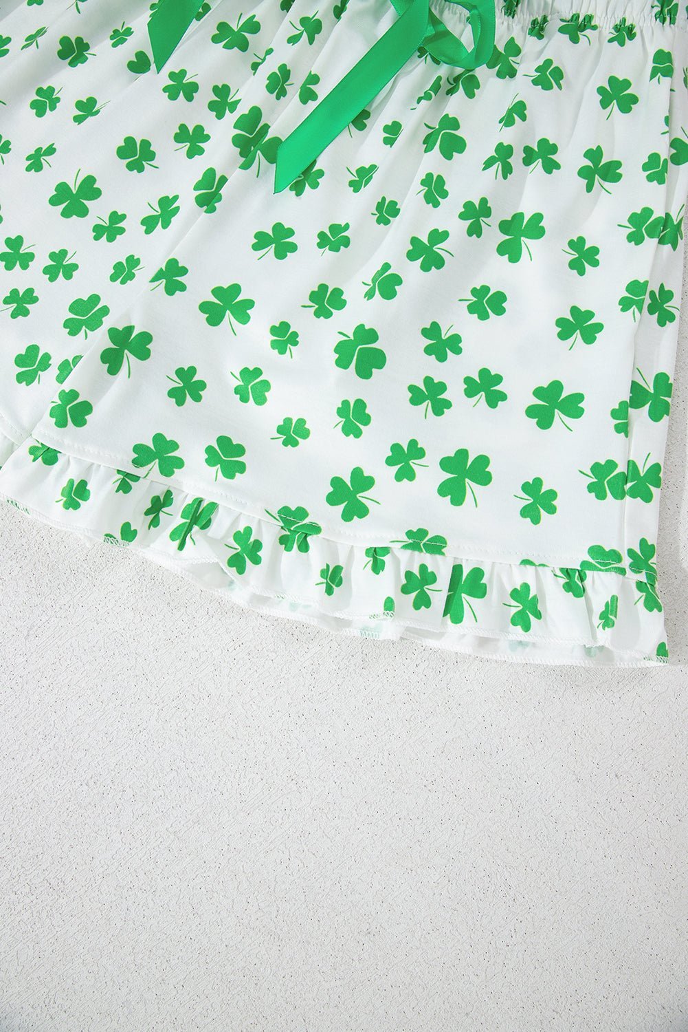 Green shamrock pattern on a white background