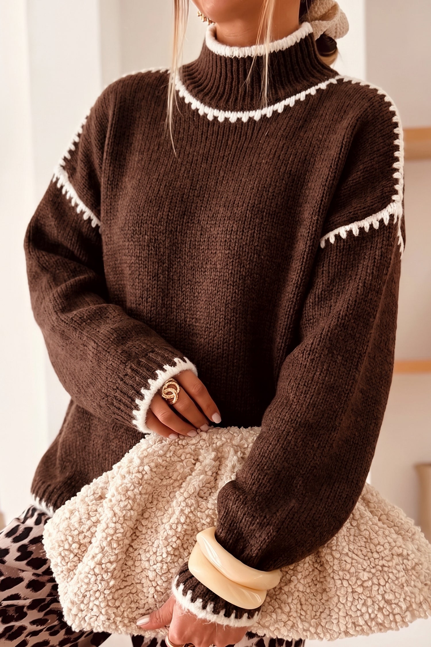 Coffee brown mock neck sweater with cream blanket stitch trim, front view