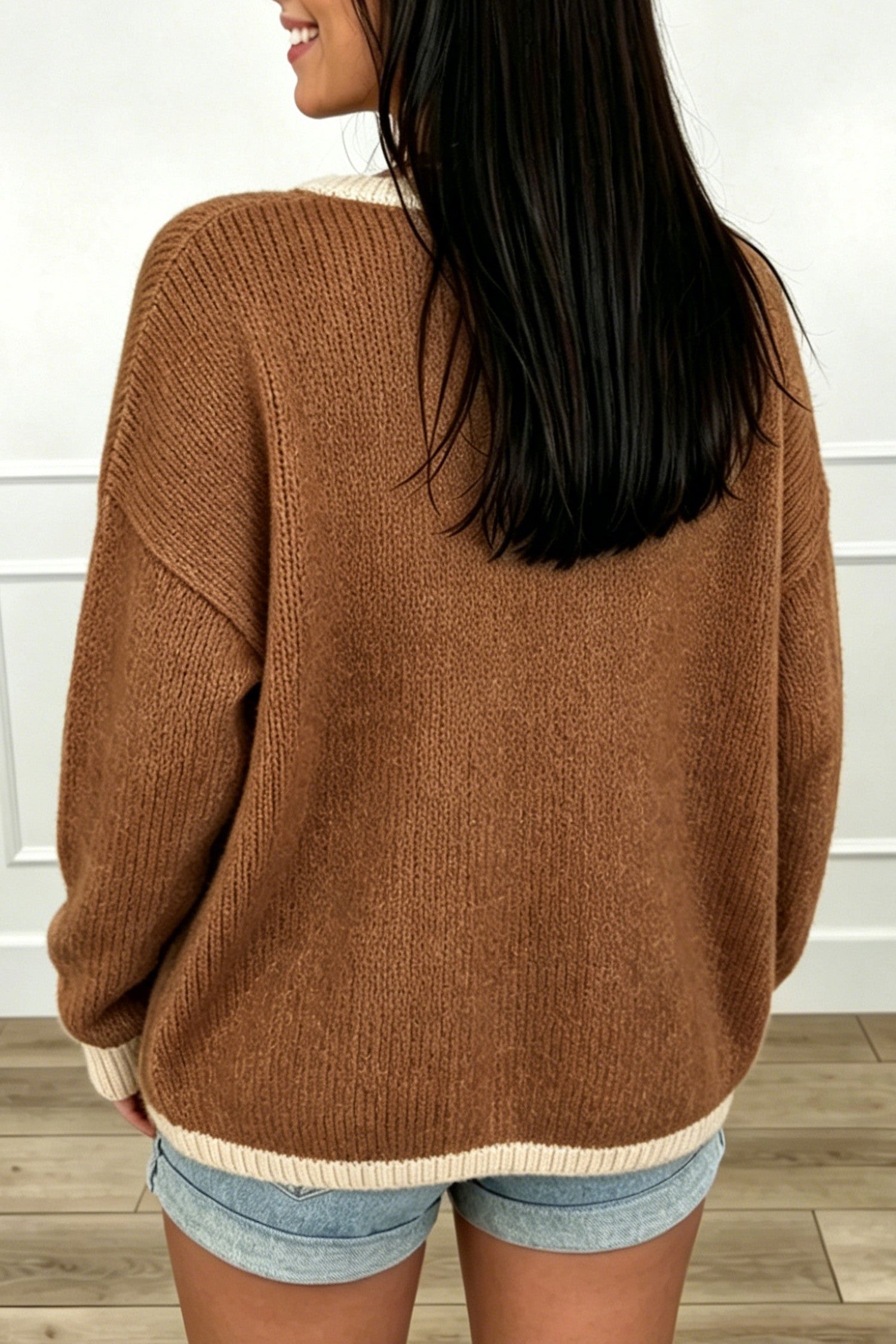 Back view of chestnut oversized knit cardigan with cream contrast hem