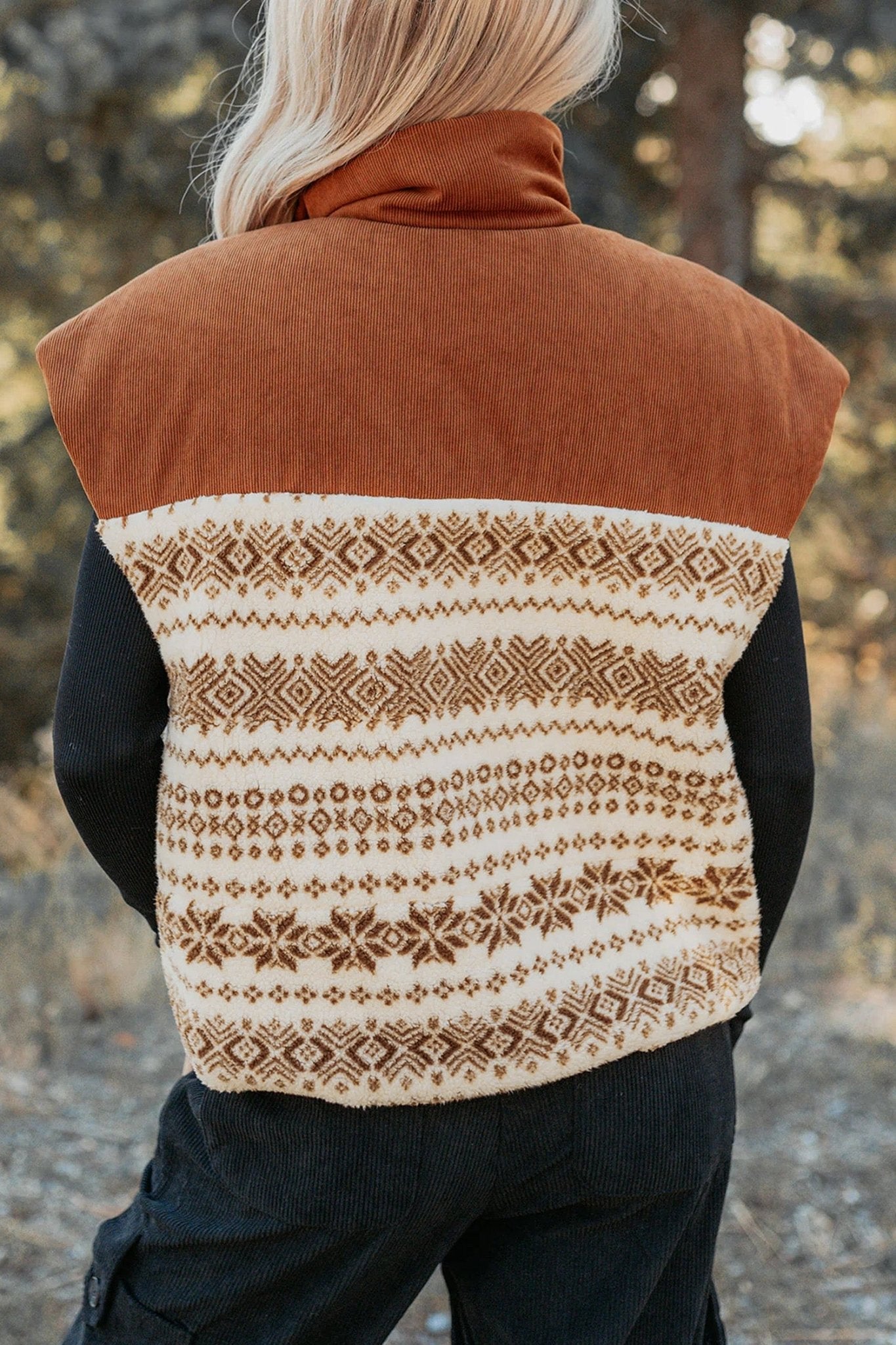 Back view of person in rust brown and cream Fair Isle turtleneck vest.