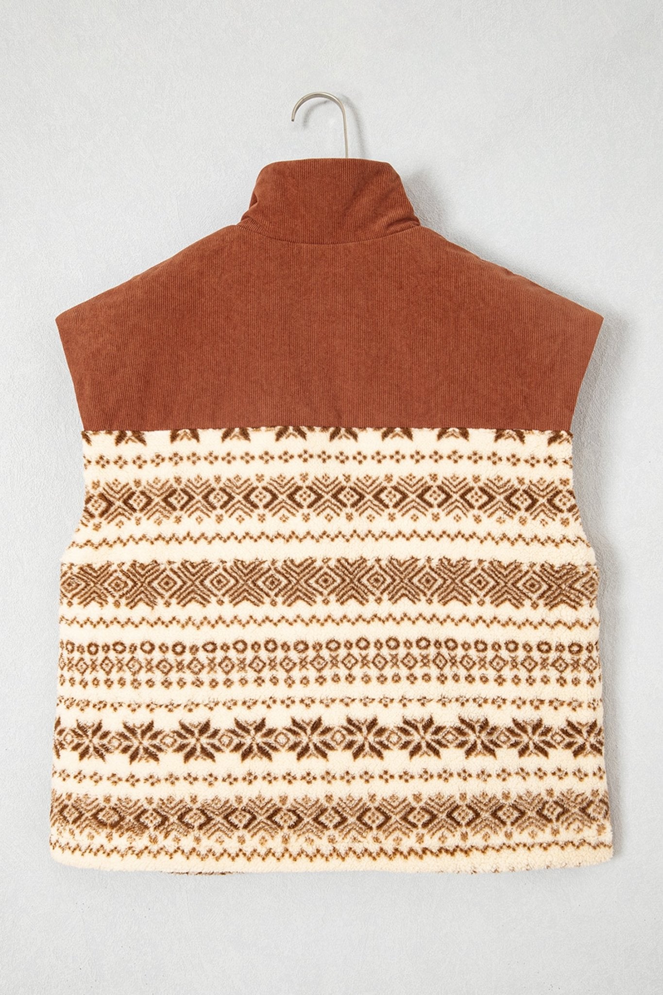 Rust-brown mock-neck vest with cream-brown Fair Isle pattern on hanger.
