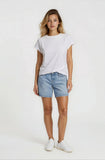 Woman wearing a white t-shirt and denim shorts on a white background