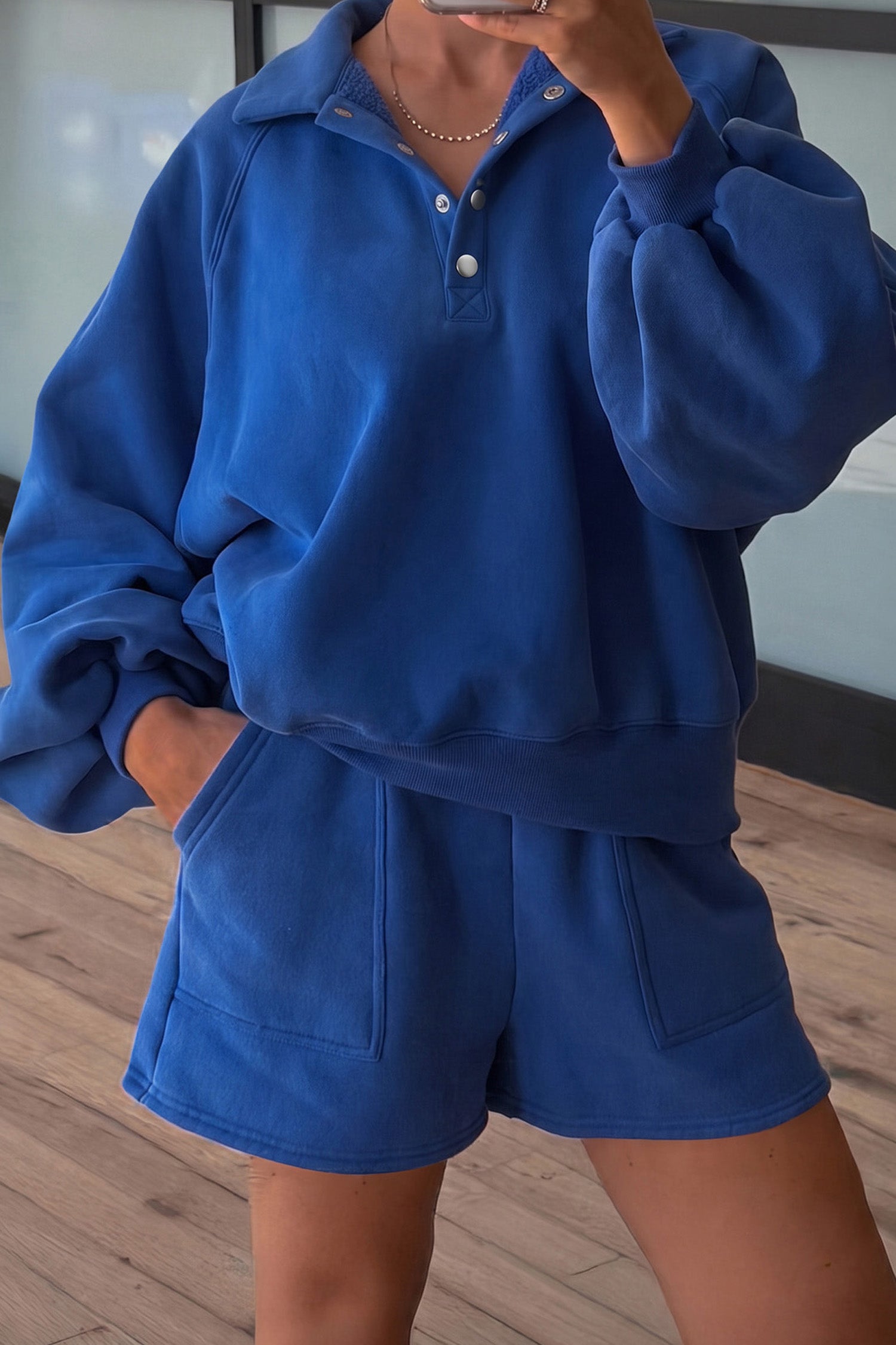 Dark blue half button puff sleeve pullover and shorts 2-piece set, front view