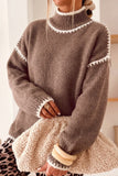 Dark khaki mock neck sweater with cream blanket stitch trim and a sherpa bag