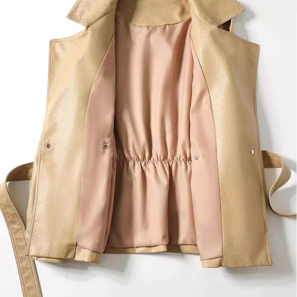 Beige trench coat with a pink shirt underneath on a white background