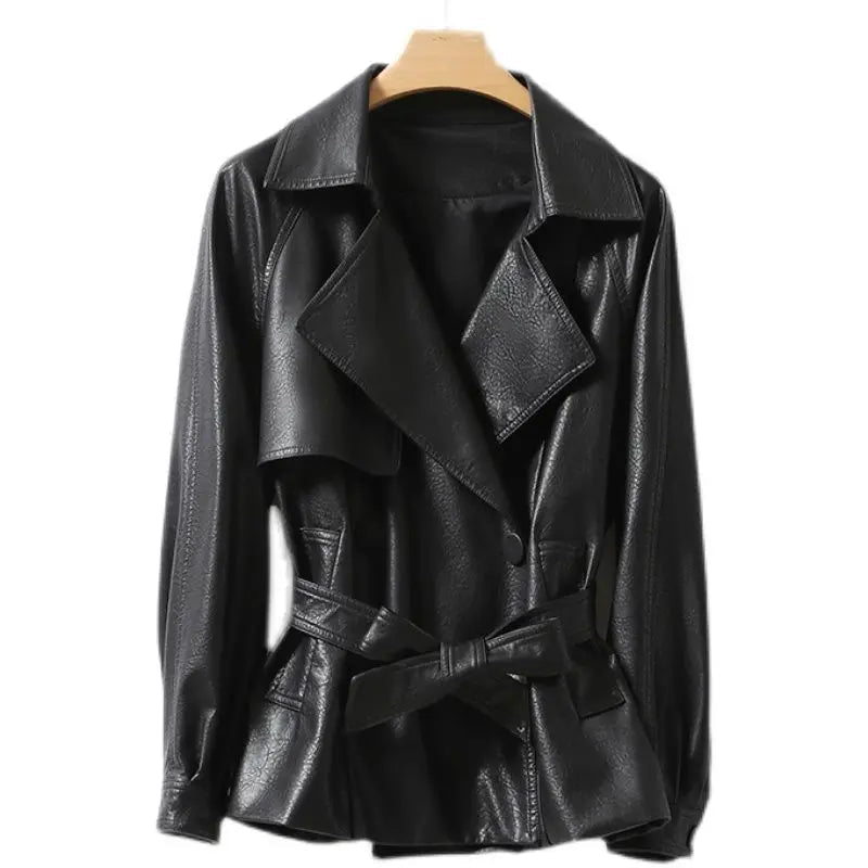 Black leather jacket on a wooden hanger against a white background
