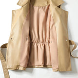 Beige leather jacket with pink lining on a white background