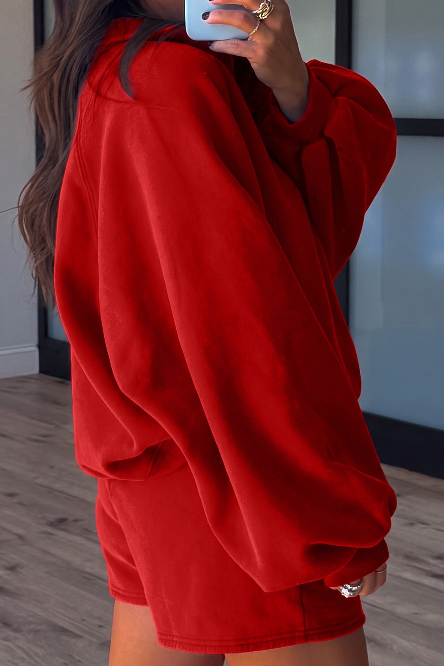 Fiery red pullover and shorts set, side view showing oversized balloon sleeves