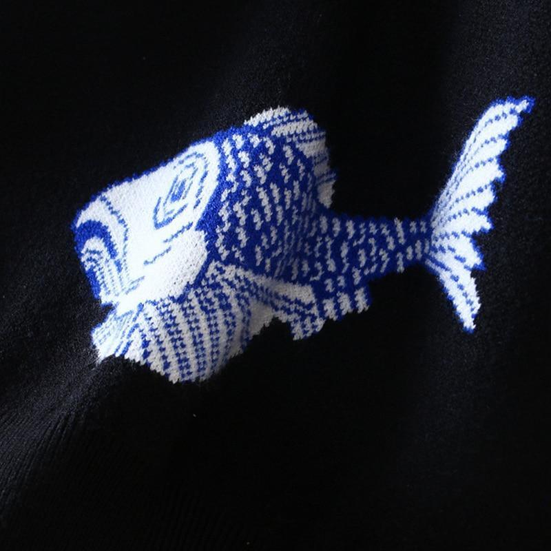 Blue fish-shaped object on a black background