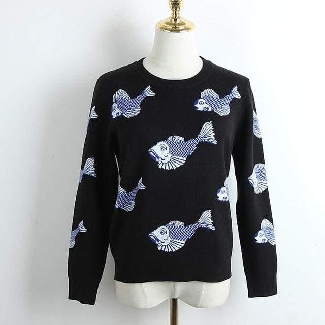 Black sweater with blue fish pattern on a mannequin against a white background
