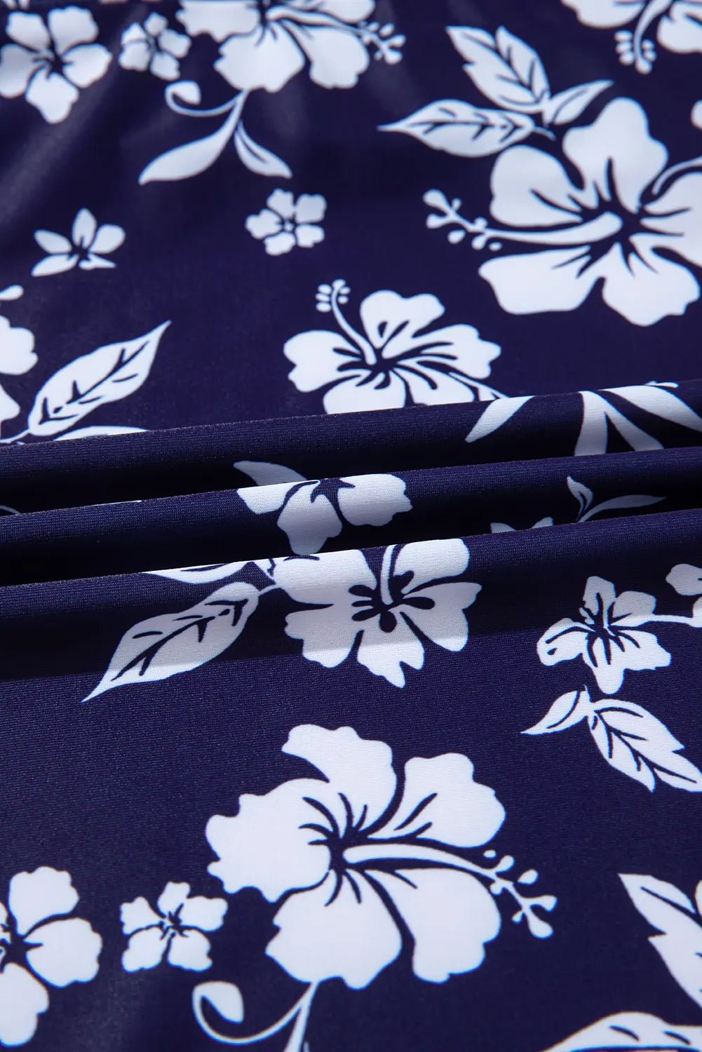 Navy blue fabric with white floral pattern