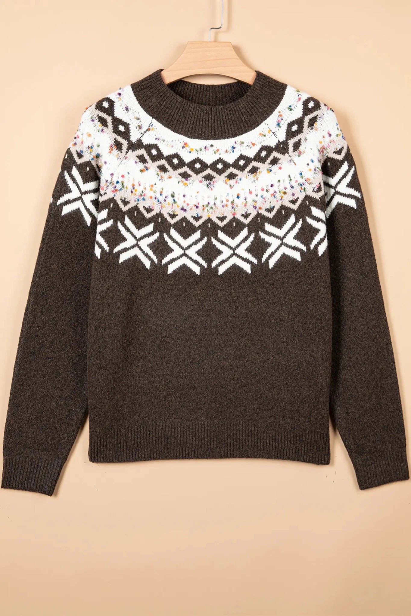 Dark brown knit sweater with a white Fair Isle yoke and snowflake patterns.