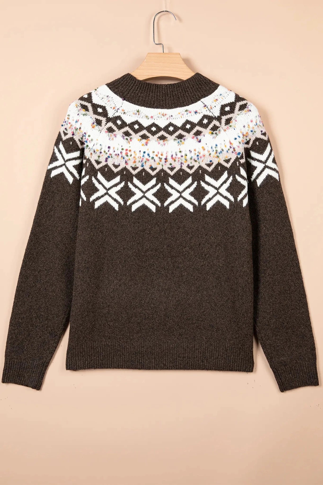 Dark brown knit sweater with a white Fair Isle pattern across the chest and shoulders.