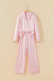 Pink-white gingham pajamas with collar, tie belt, and wide-leg pants on hanger.