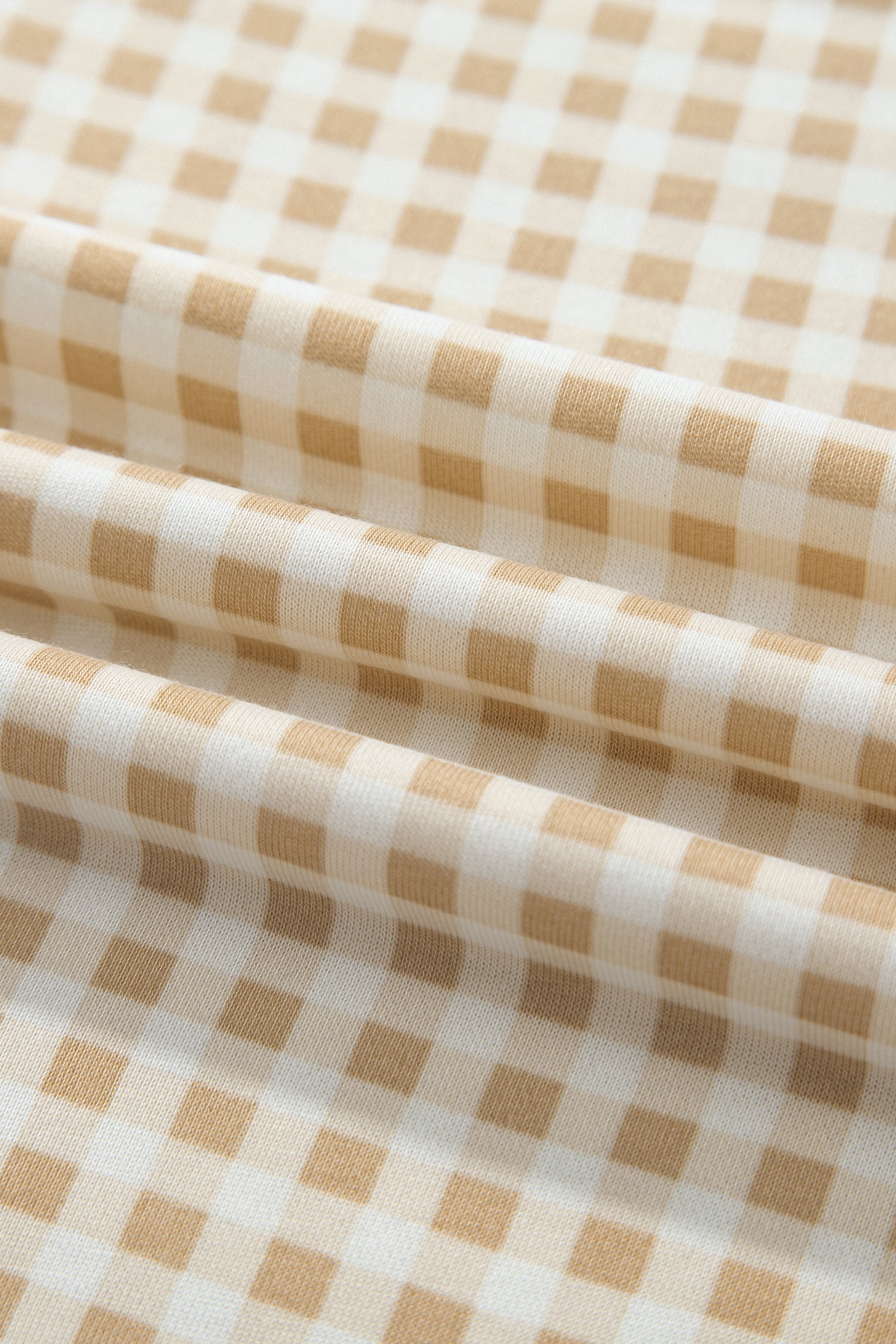 Close-up of khaki and white gingham fabric