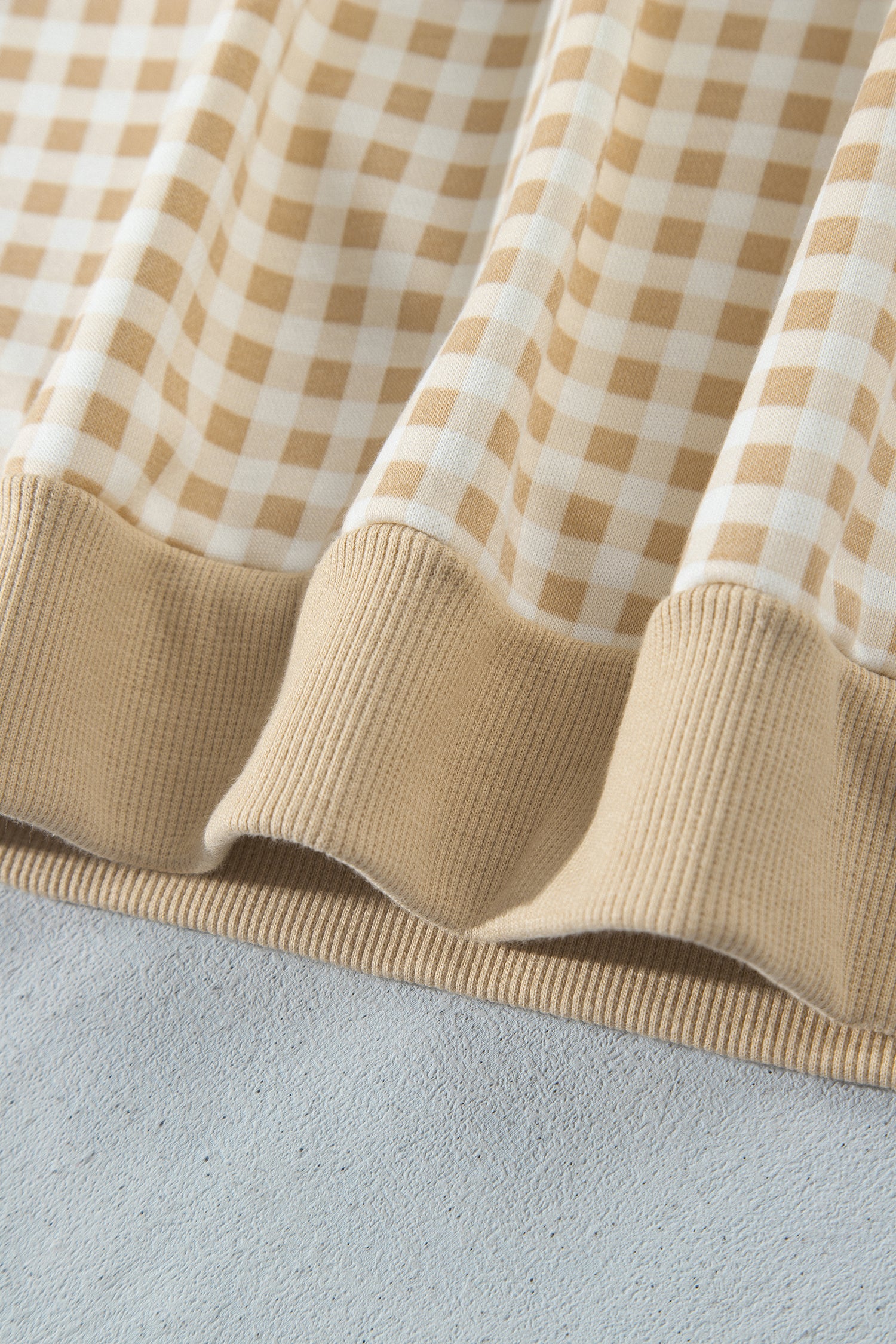 Khaki gingham pullover ribbed hem band detail