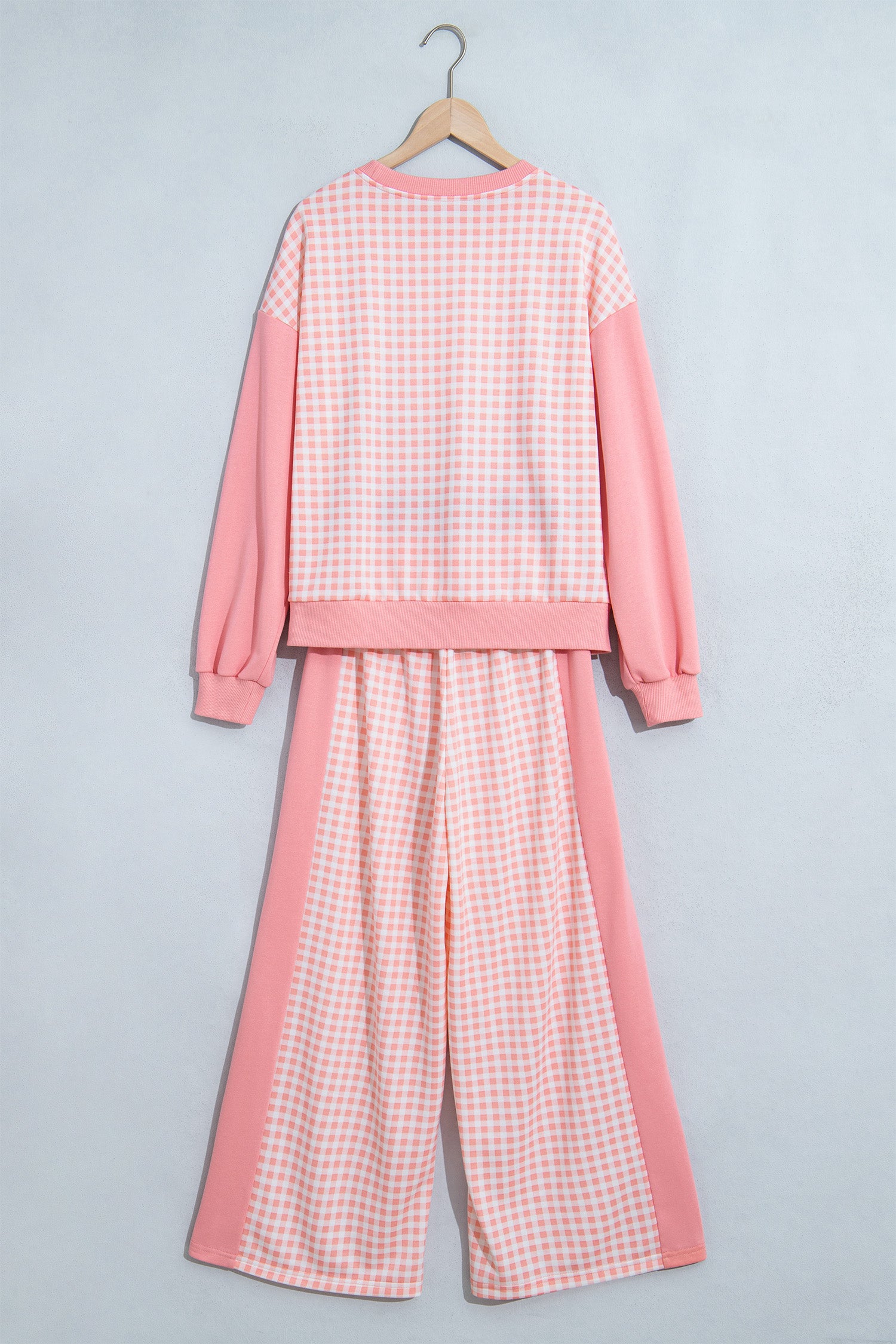 Pink gingham color block set on a hanger, back view