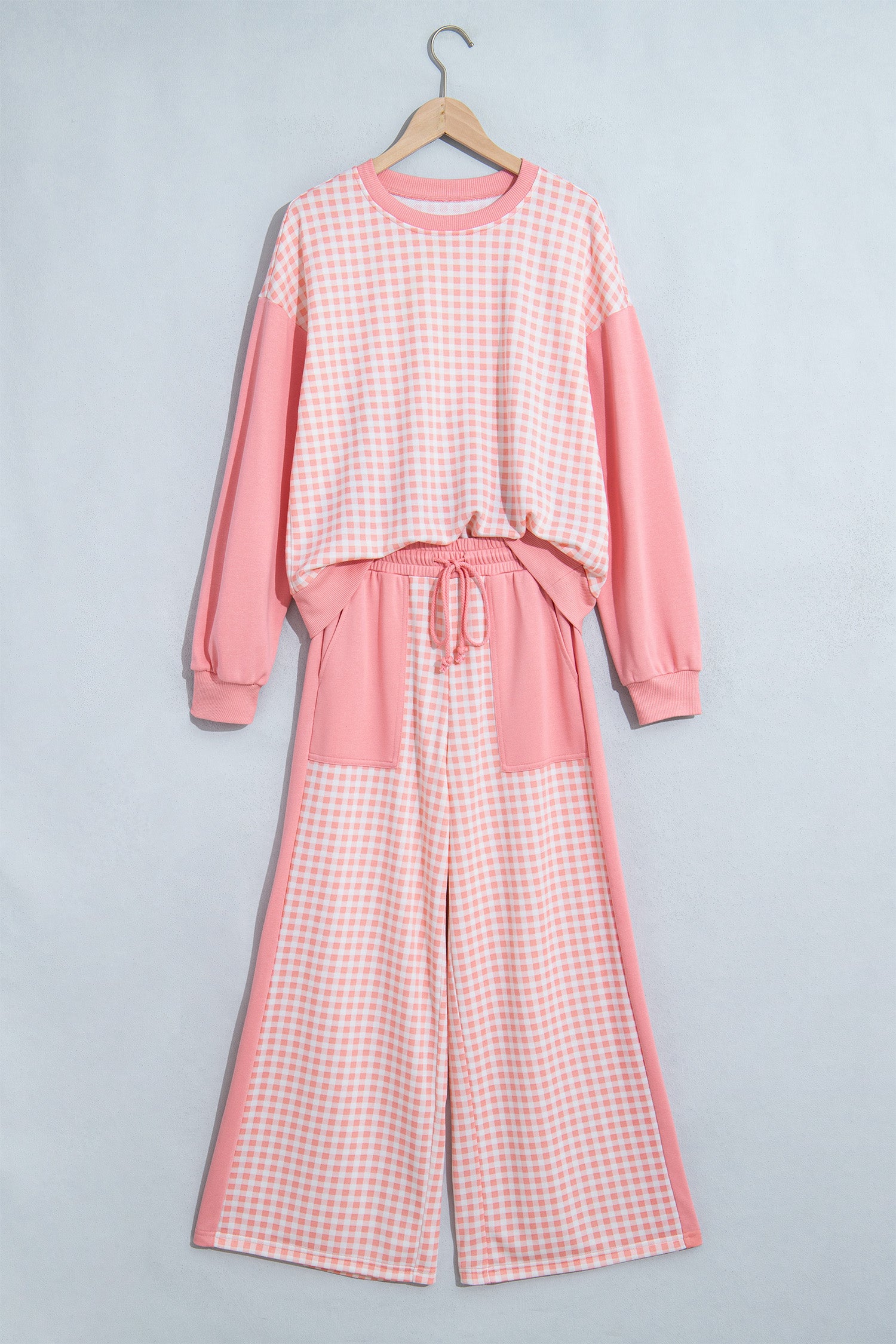 Pink gingham color block set on a hanger, front view