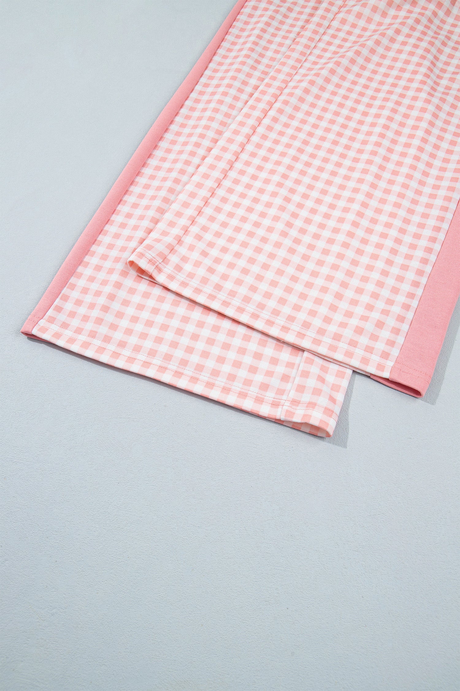 Pink gingham wide leg pants hem and side panel detail