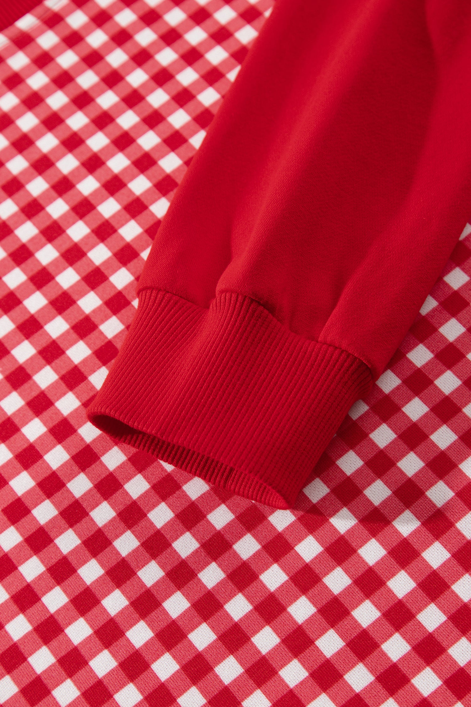 Red gingham pullover solid ribbed cuff detail