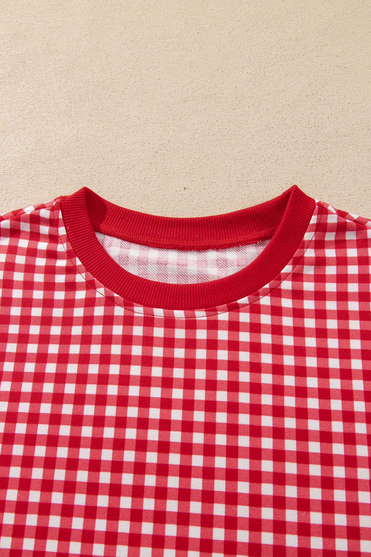 Red gingham pullover ribbed round neckline detail
