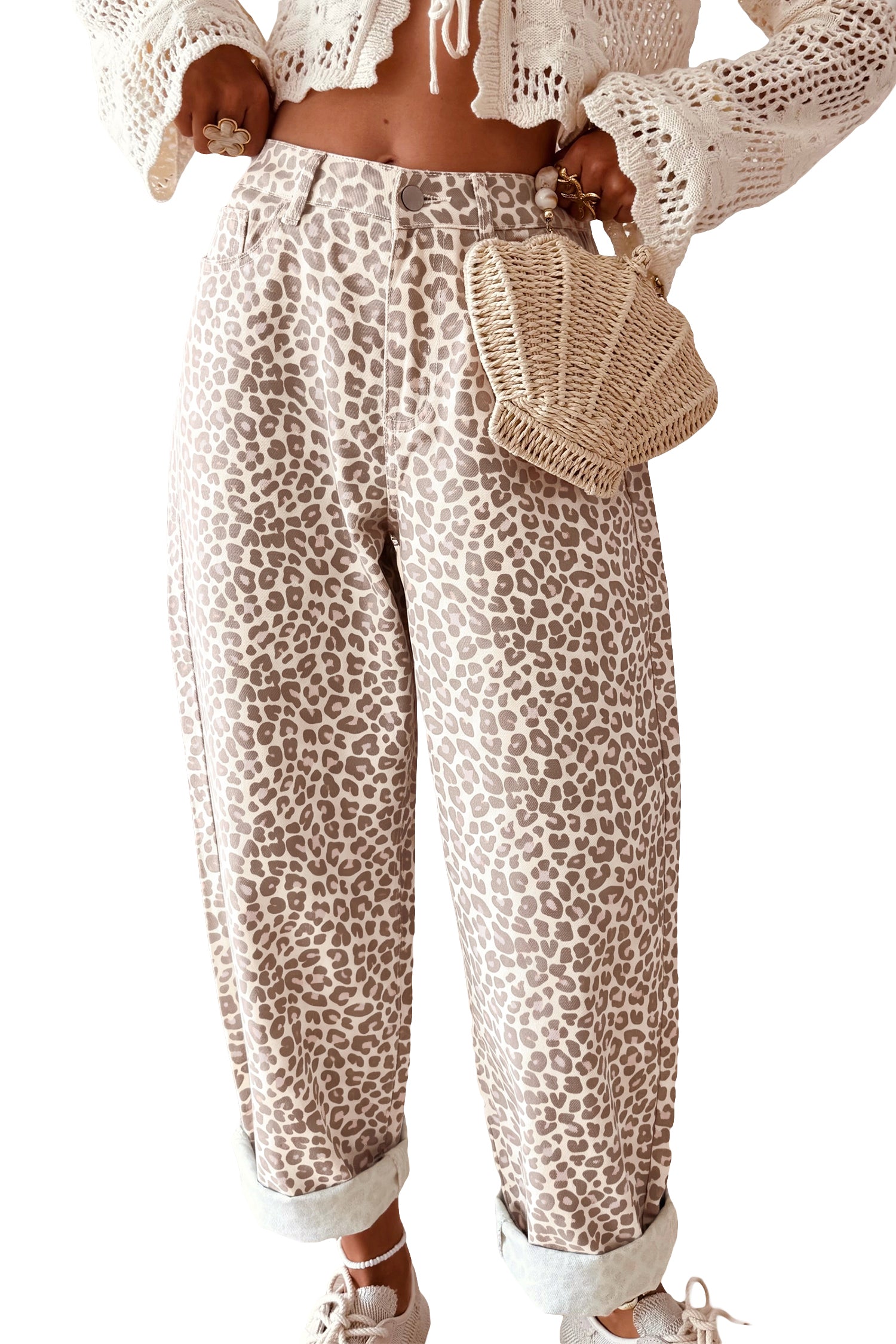 High rise gray leopard jeans styled with cream knit cardigan and woven bag