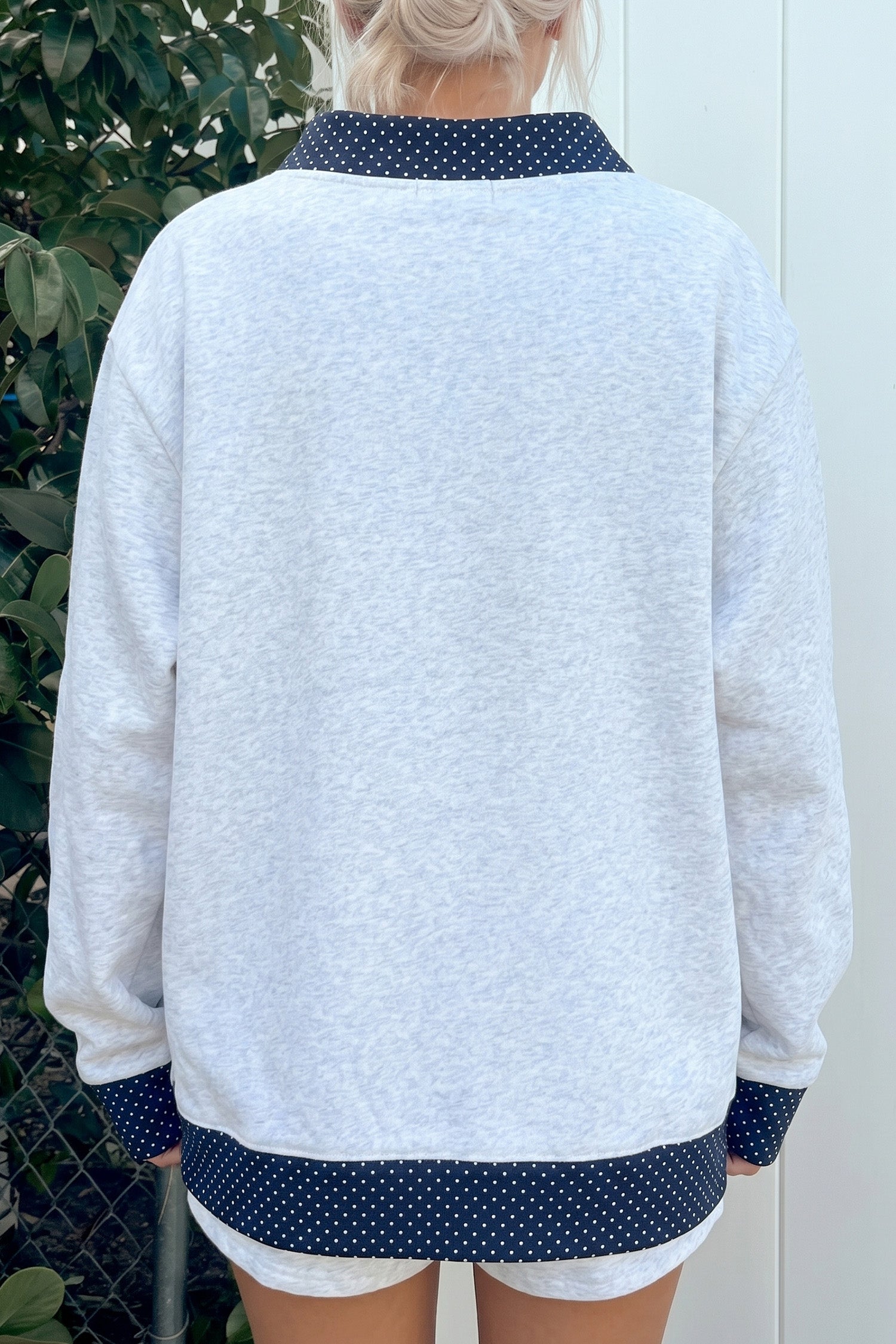 Gray polka dot contrast trim tunic sweatshirt, back view on model