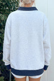 Gray polka dot contrast trim tunic sweatshirt, back view on model
