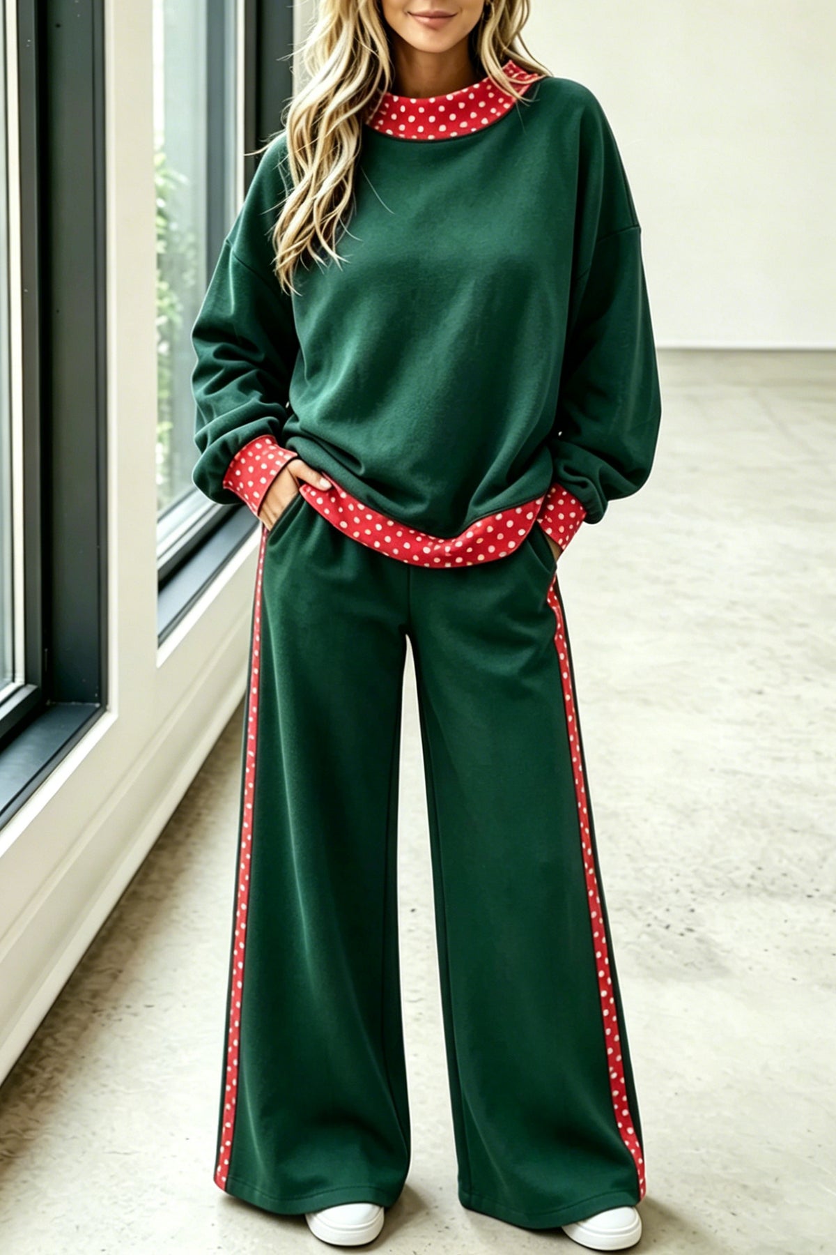 Green sweatshirt and wide-leg pants set with red polka dot trim, front view
