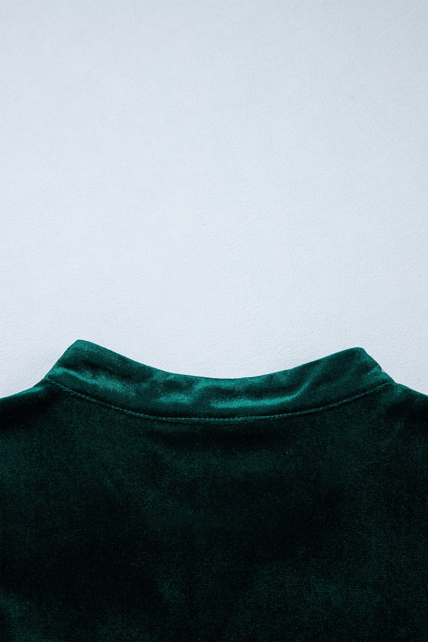 Back stand collar detail on blackish green velvet dress