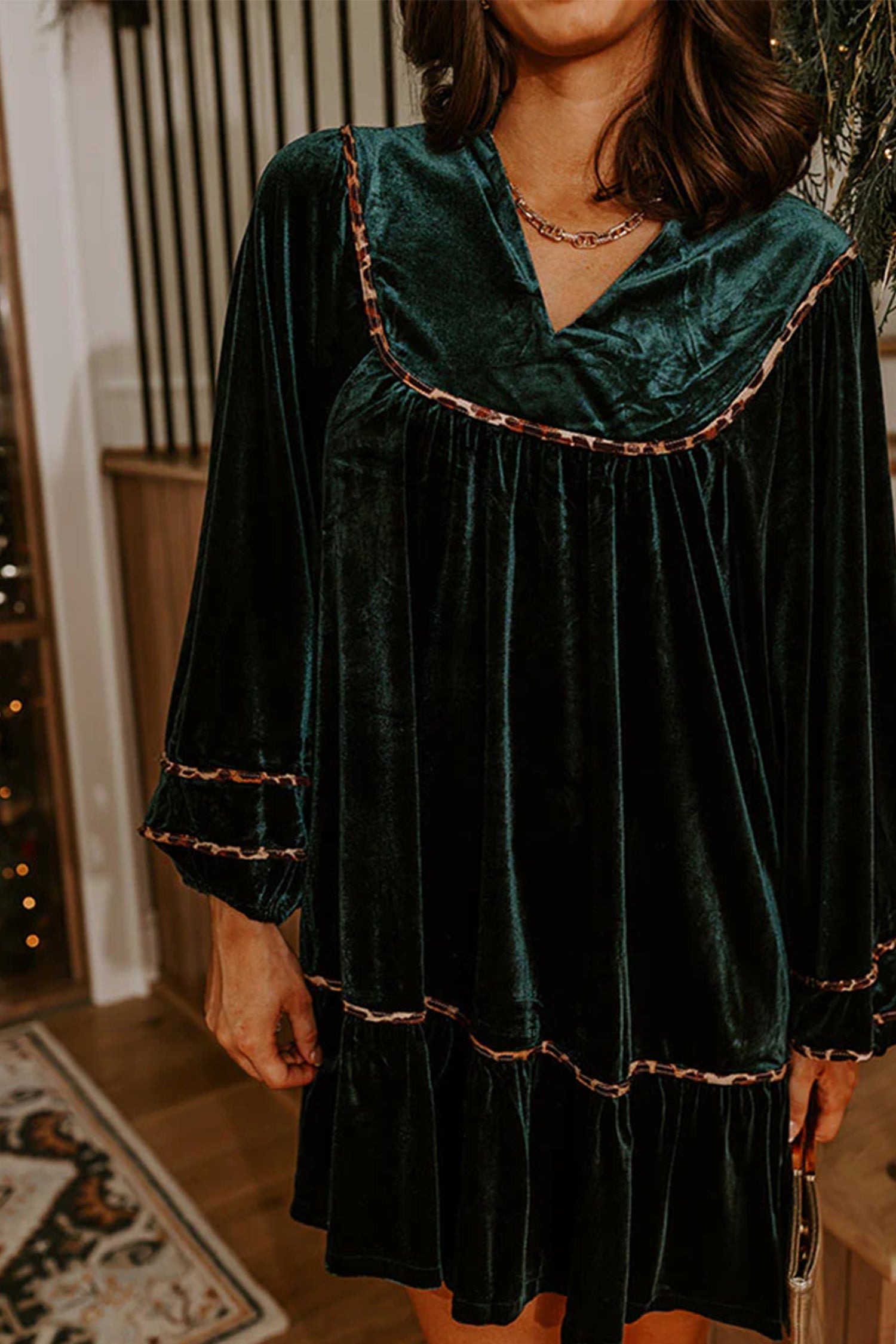 Green velvet shift dress with leopard trimmed yoke and sleeves, close view