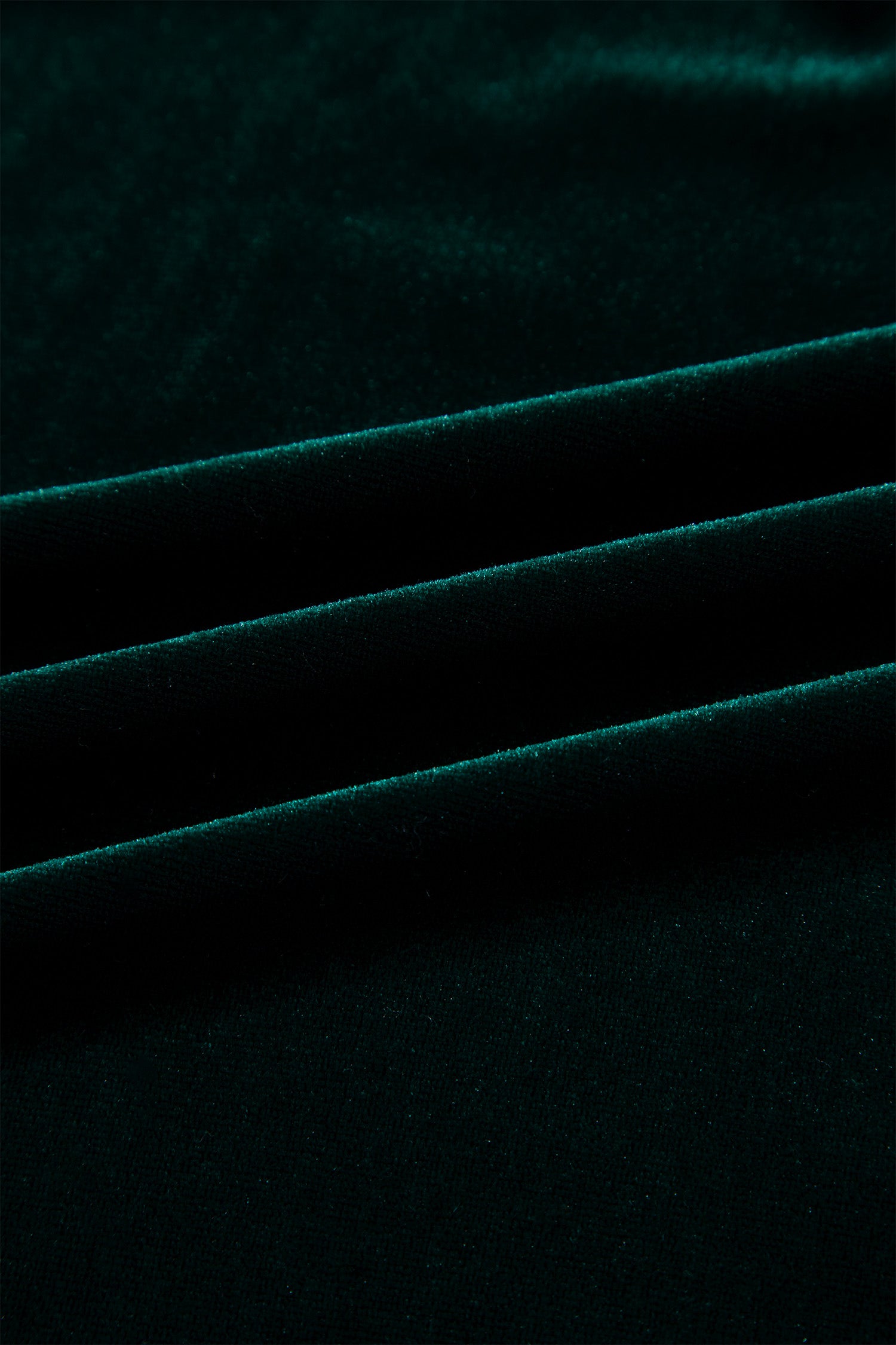 Close-up of soft blackish green stretch velvet
