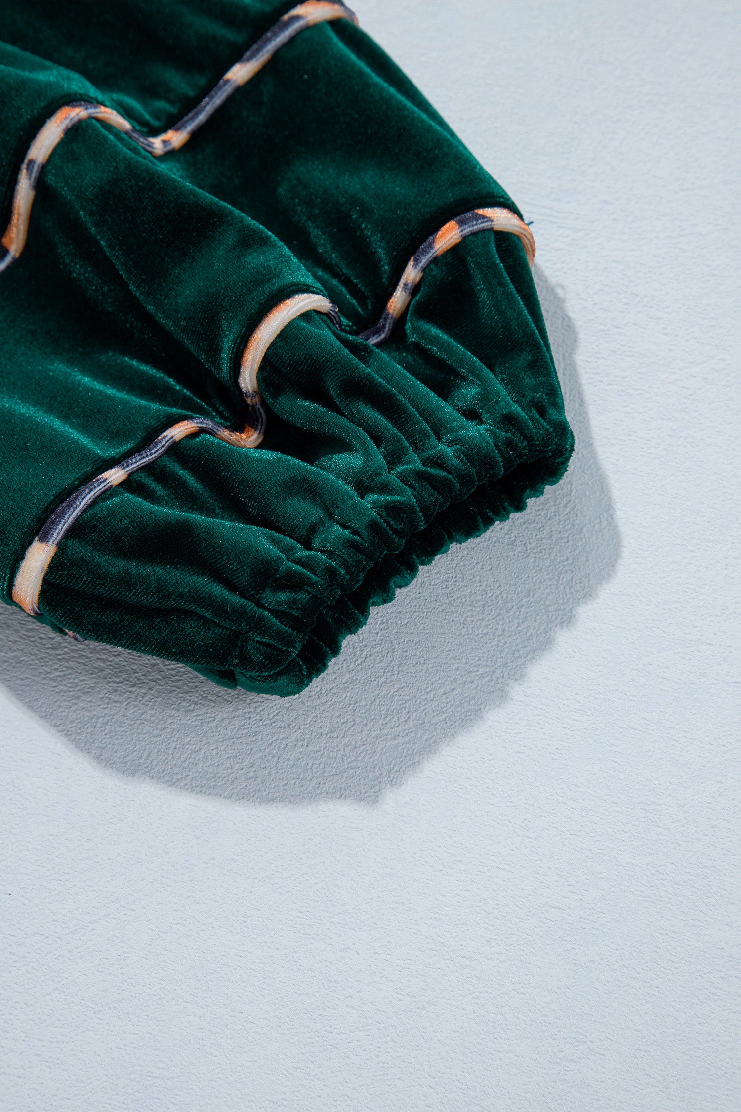 Balloon sleeve with leopard trimmed bands and elastic cuff on green velvet dress