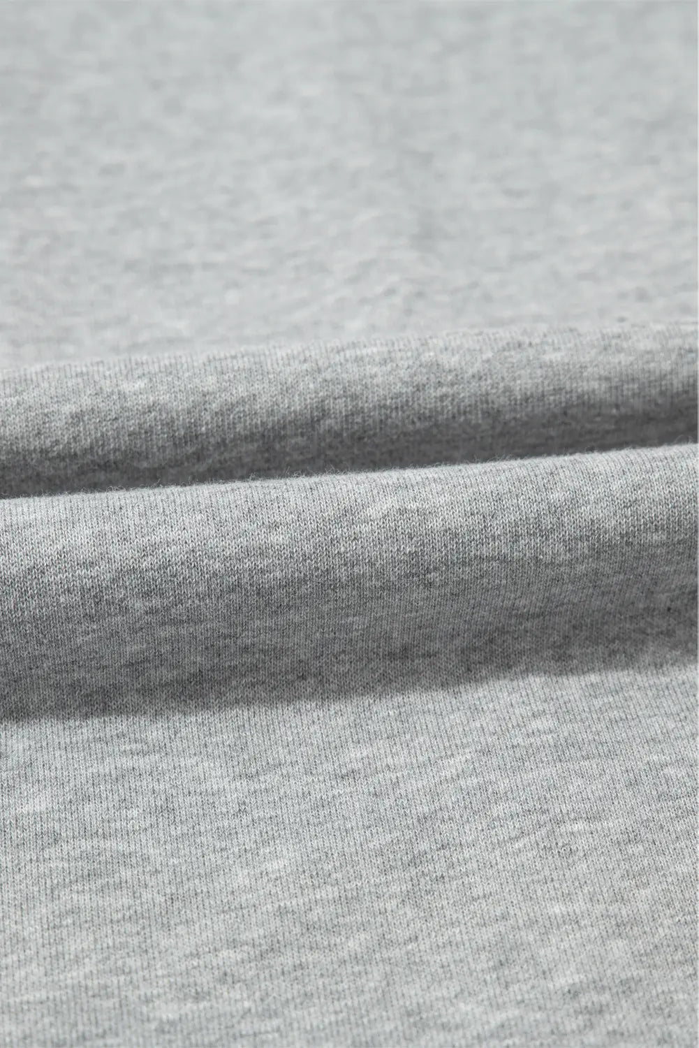 Close-up of gray fabric with a subtle texture