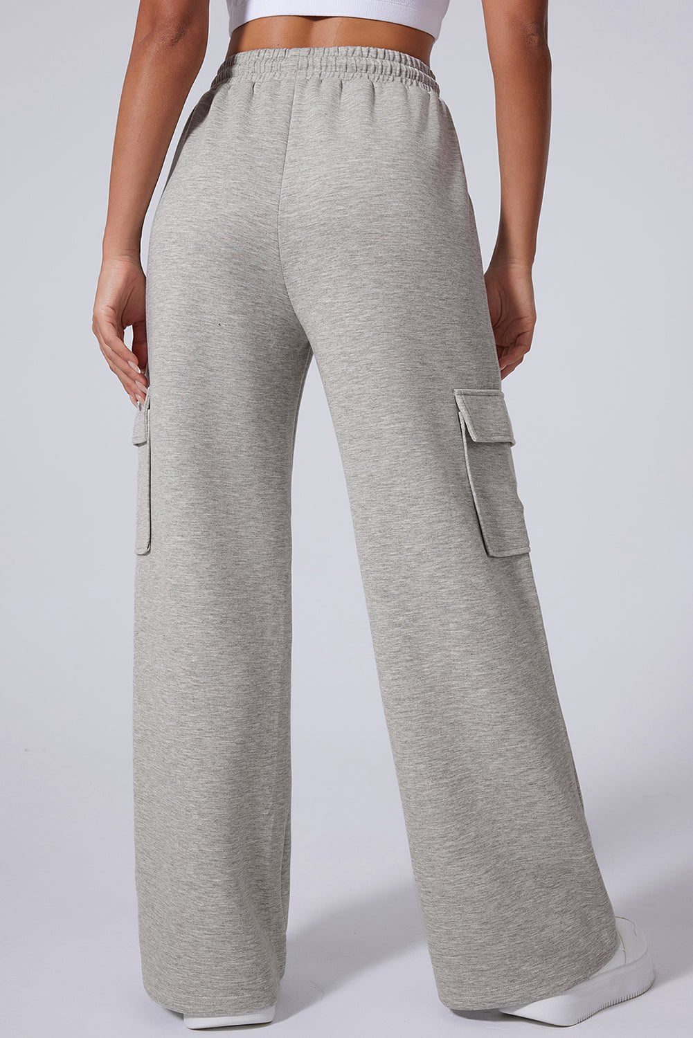 Back view of person in light gray wide-leg cargo sweatpants.