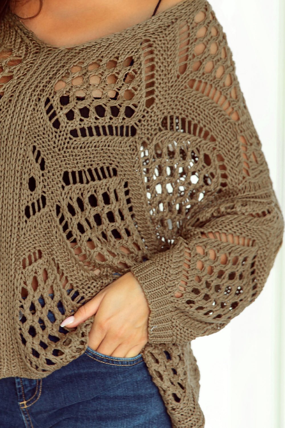 Brown crochet sweater with a white background