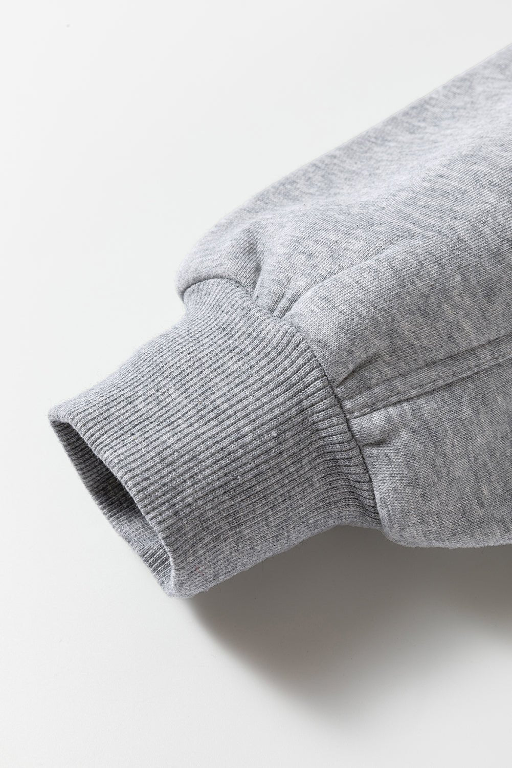 Close-up of a gray fabric texture on a light background