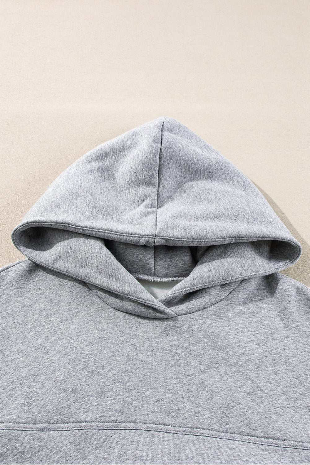 Gray hoodie on a beige background