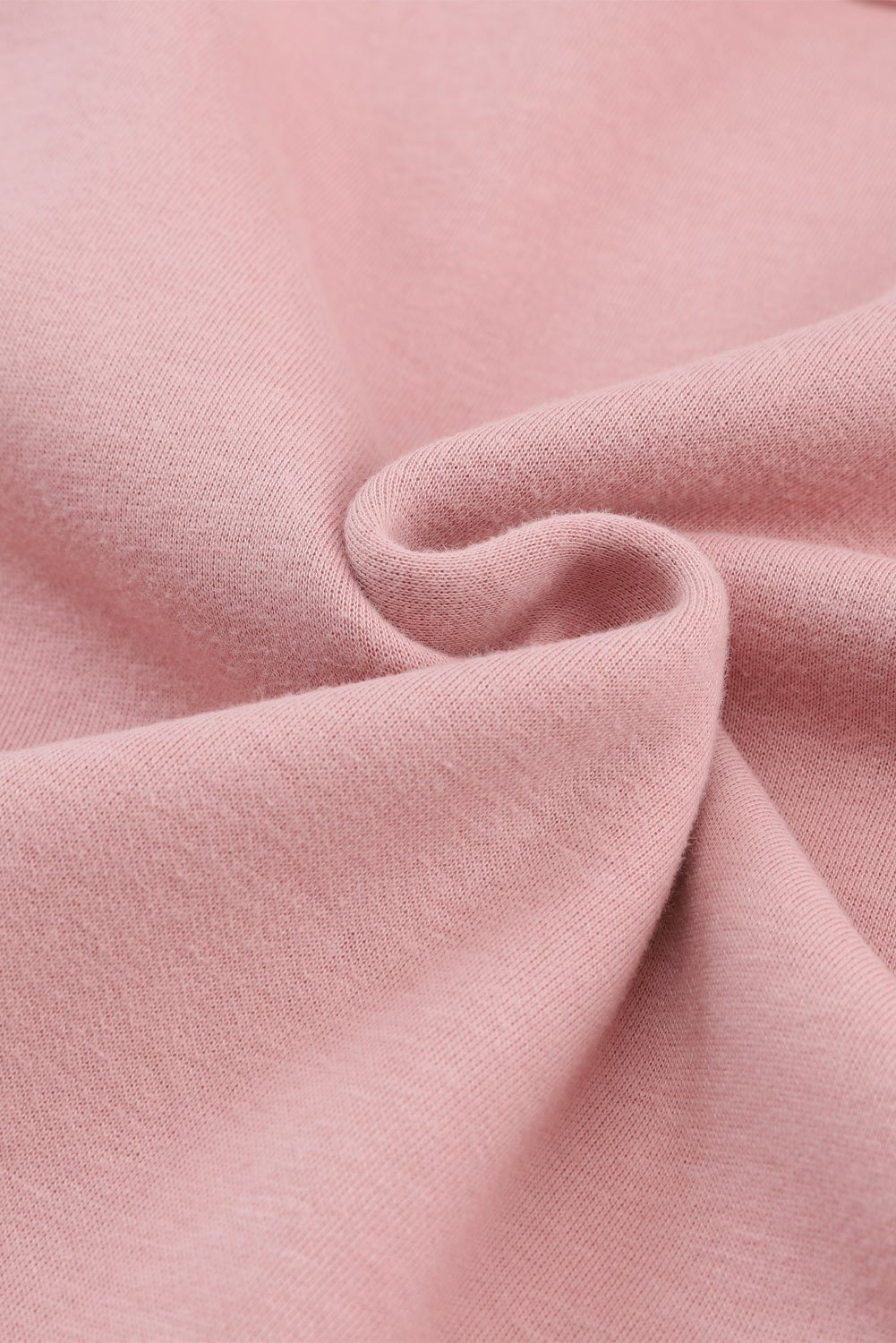 Close-up of pink fabric with a soft texture