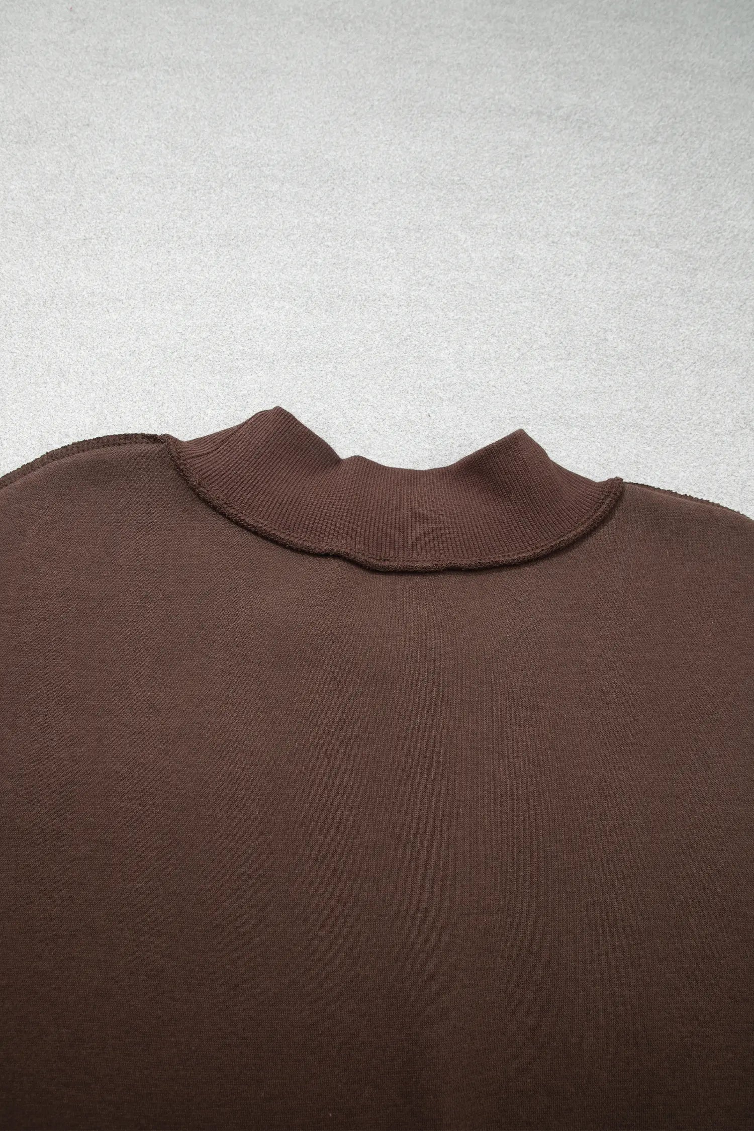 Back mock neck with exposed seam on coffee sweatshirt