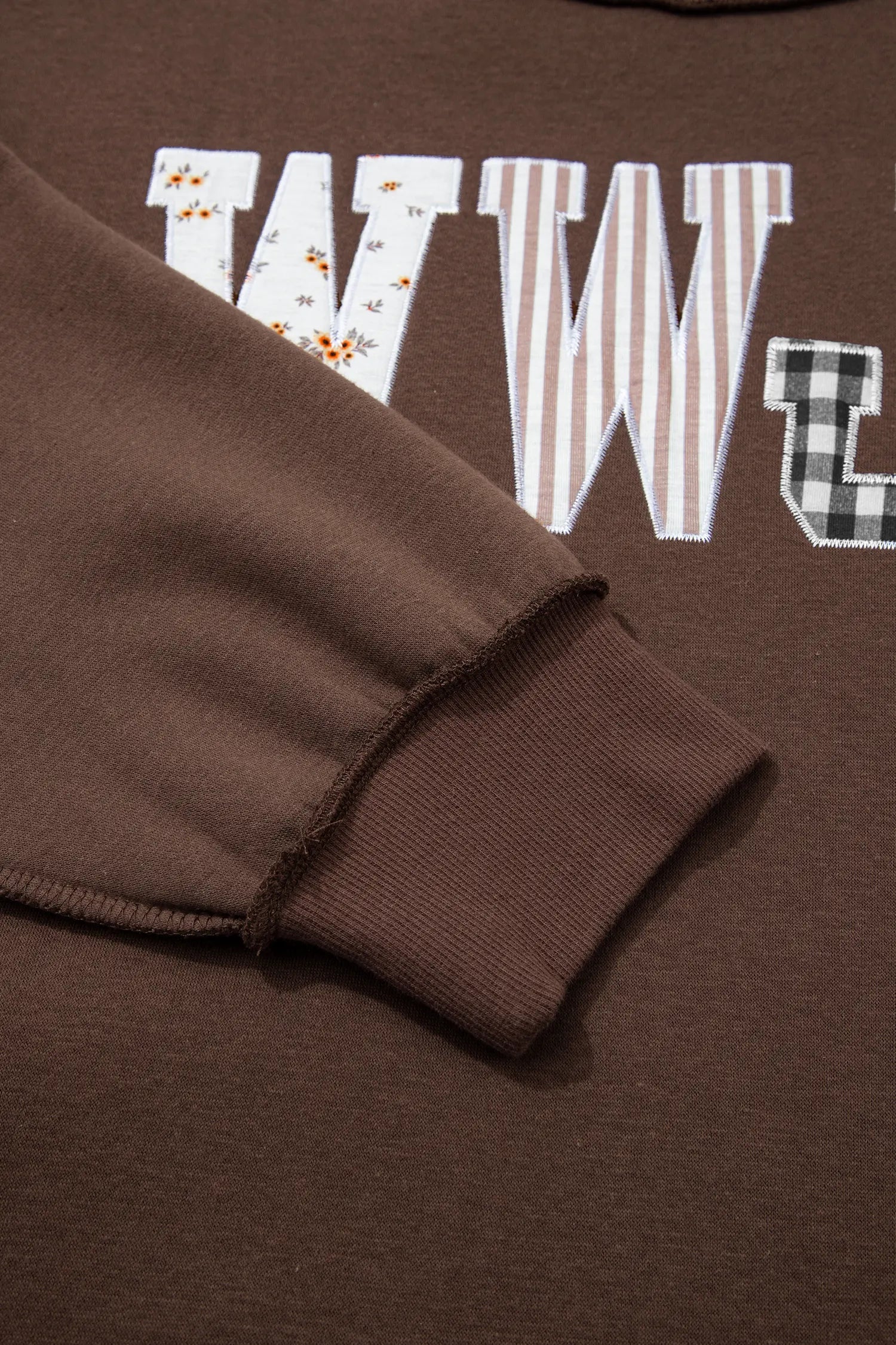 Ribbed balloon sleeve cuff on coffee WWJD sweatshirt