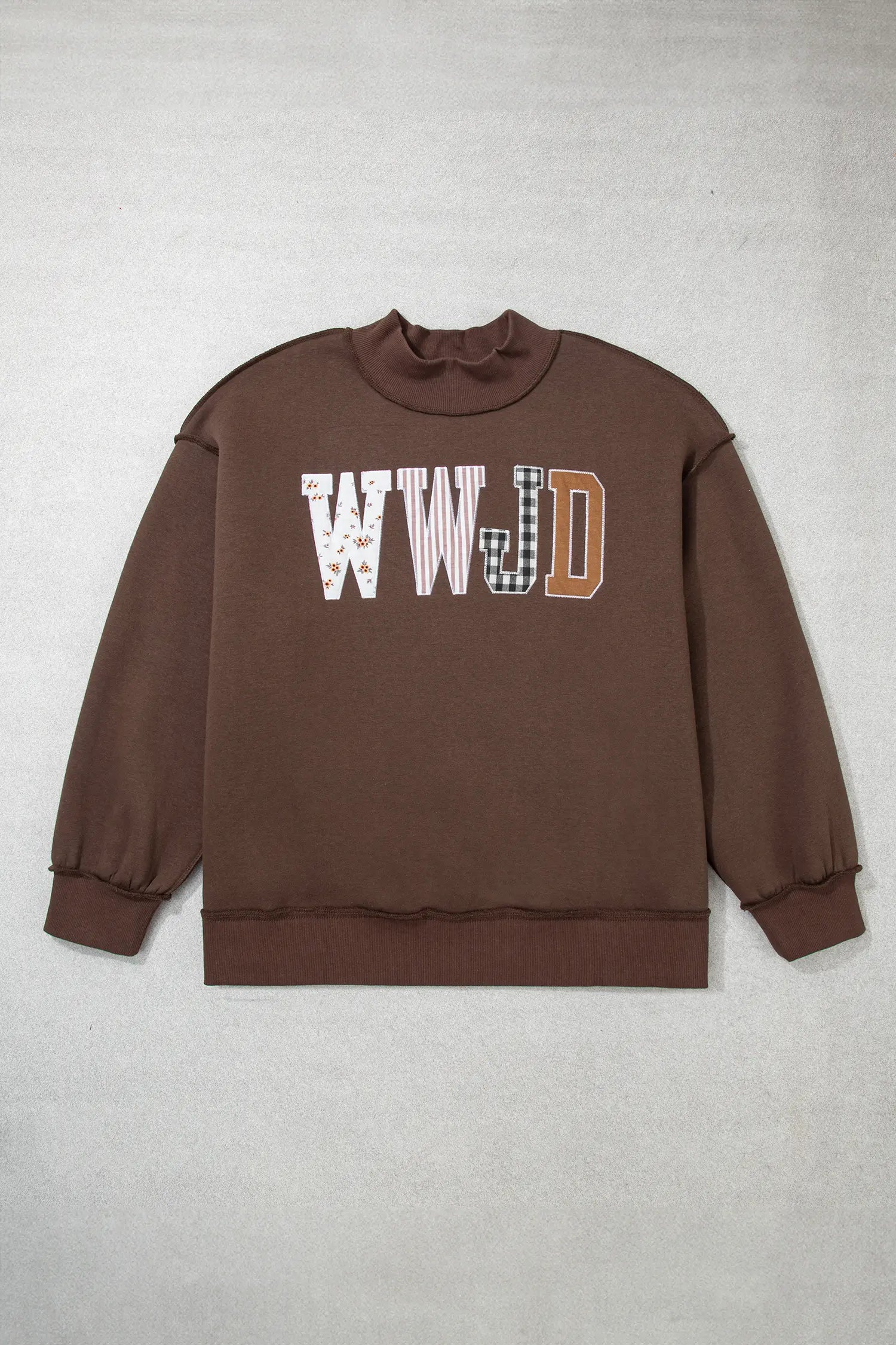 Coffee WWJD patchwork letter mock neck sweatshirt laid flat, front view
