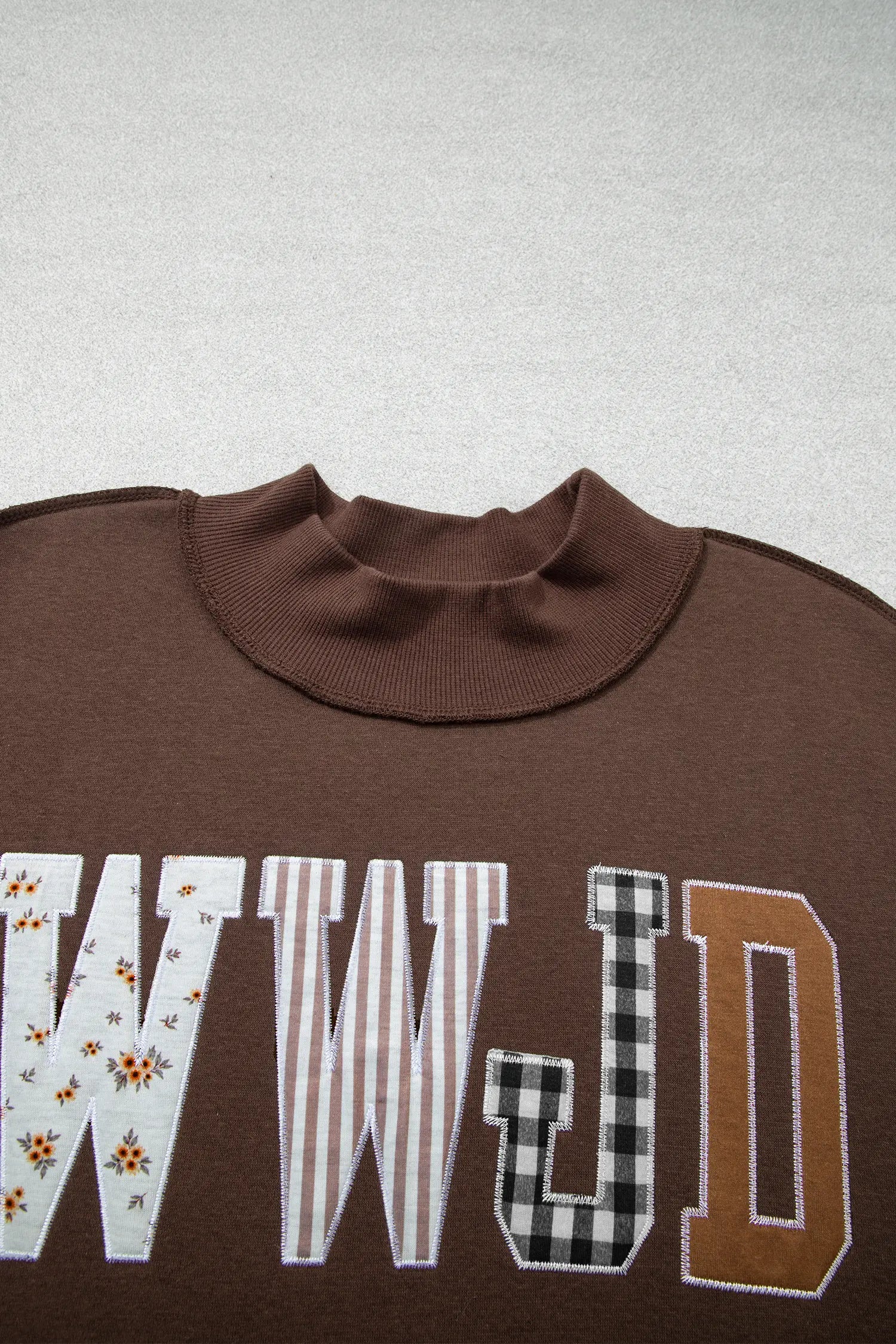 Mock neck and floral, stripe and gingham WWJD letters on coffee sweatshirt