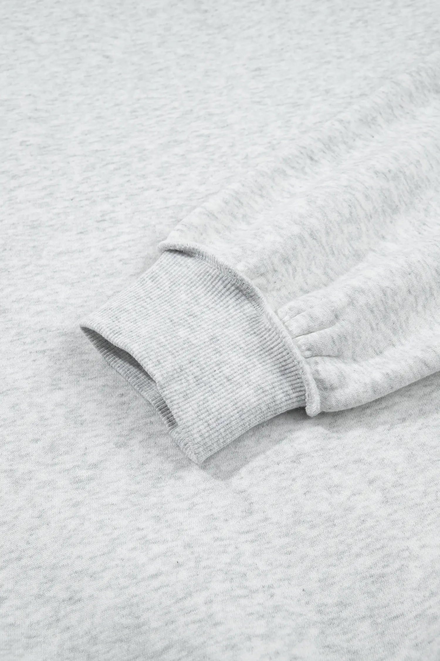 Ribbed balloon sleeve cuff on gray heather sweatshirt