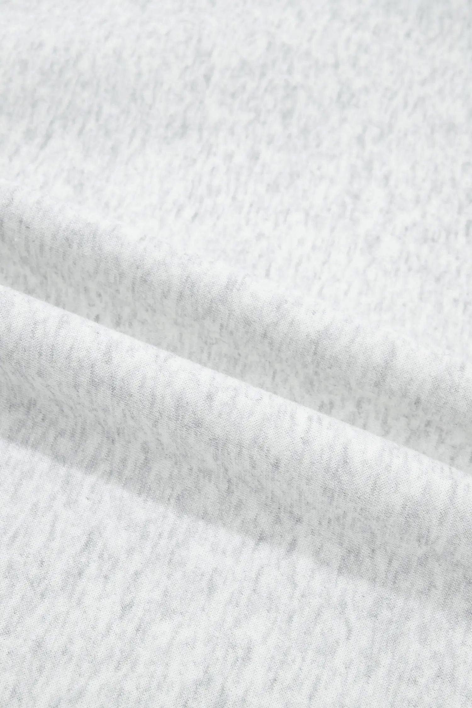 Close-up of soft gray heather fleece fabric