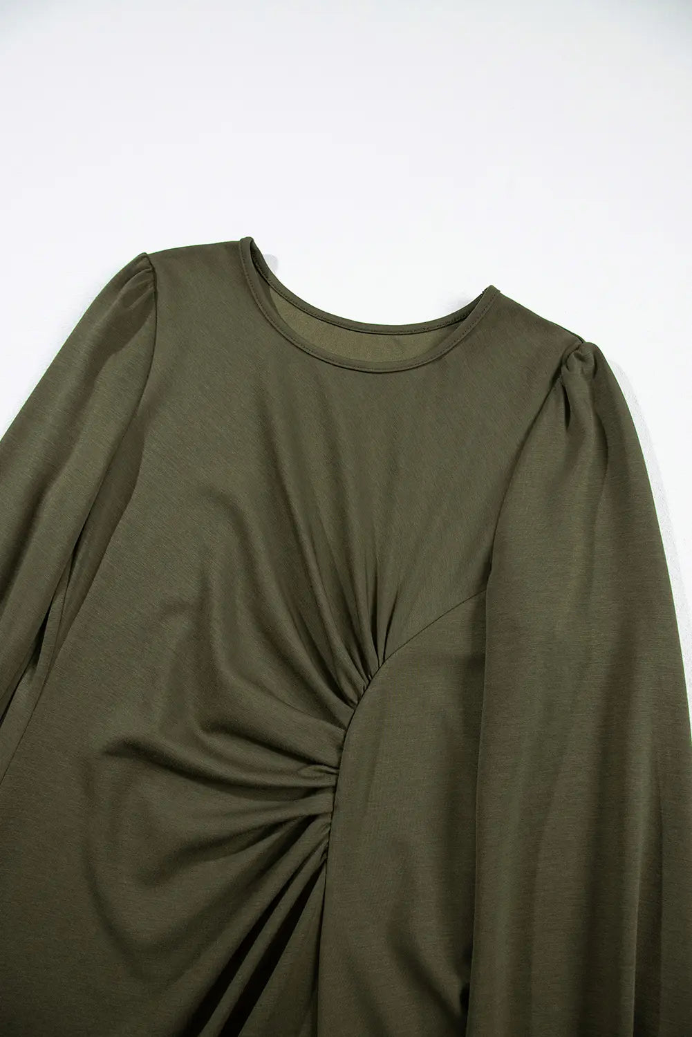 Round neckline and gathered front ruche on jungle green dress