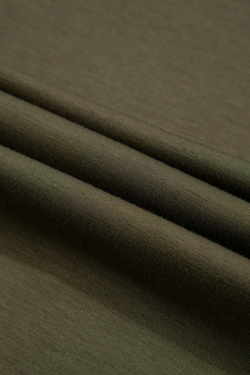 Close-up of soft jungle green stretch jersey